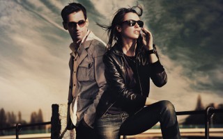 Attractive young couple wearing sunglasses